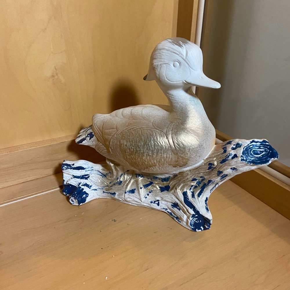 Silver Duck Figurine on Blue and White Base